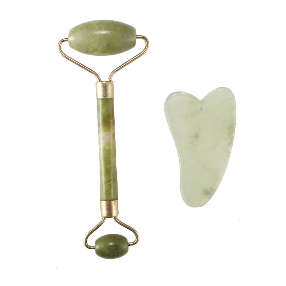 Jade facial roller and gua sha tool on a white background