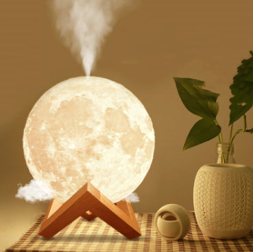 Moonlight mist maker 3D moon lamp essential oil diffuser glowing on wood stand